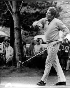 Golfer mid-swing, black and white photo